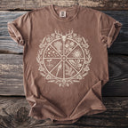 Brown t-shirt with a circular design featuring a deer skull, sun, torch, and plants.