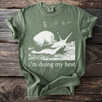Green t-shirt with white graphic of a snail and text "i'm doing my best".