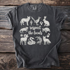 Dark grey t-shirt with desert animals and "respect the locals" text.