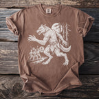 Brown t-shirt with white print of a werewolf chasing three men with lanterns through a forest.