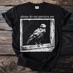 Black t-shirt with bird graphic and text "please do not perceive me".