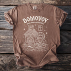 Brown t-shirt with "Domovoy slavic house spirit folklore" and folk illustration.