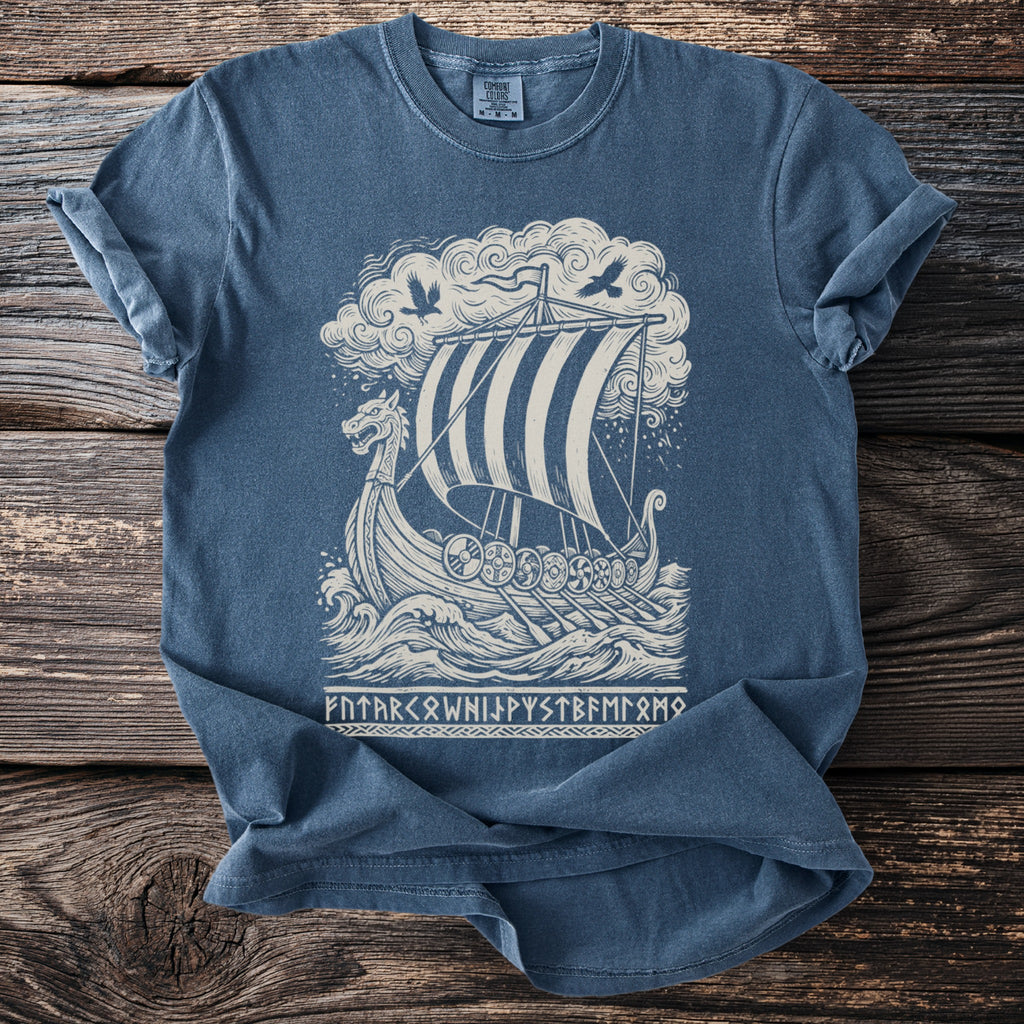 Blue t-shirt with a Viking ship design and runes below.