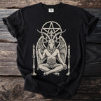 Black t-shirt with a graphic of Baphomet sitting between two candelabras.