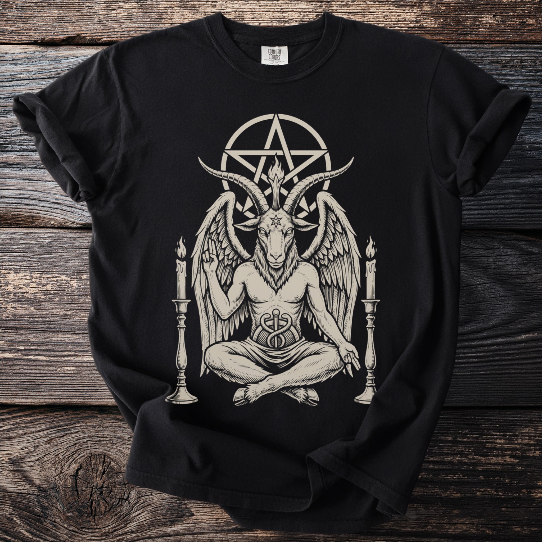 Black t-shirt with a graphic of Baphomet sitting between two candelabras.
