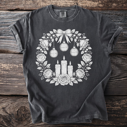 Dark gray t-shirt with white floral wreath, candles, and "Memento Mori" ornaments.