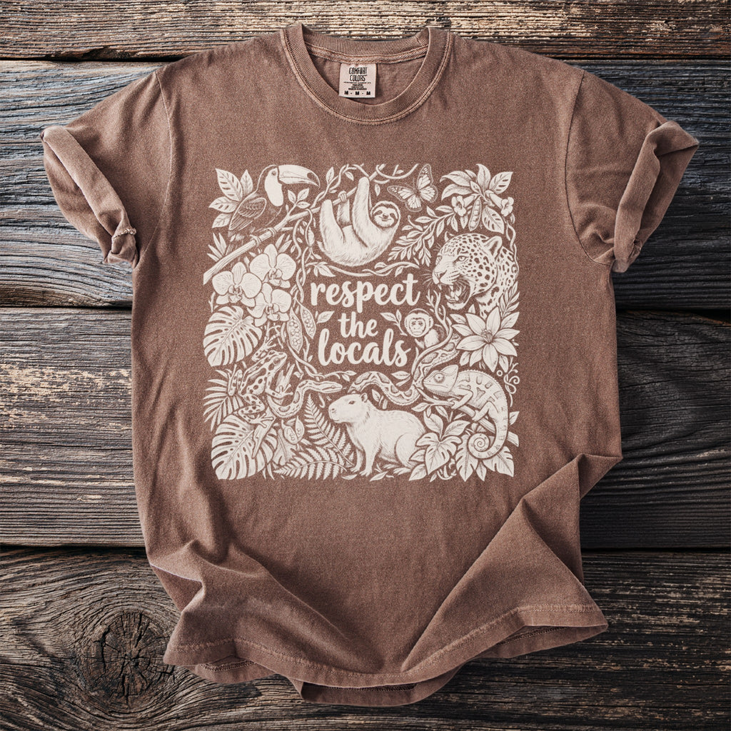 Brown t-shirt with "respect the locals" text and jungle animals in white print.
