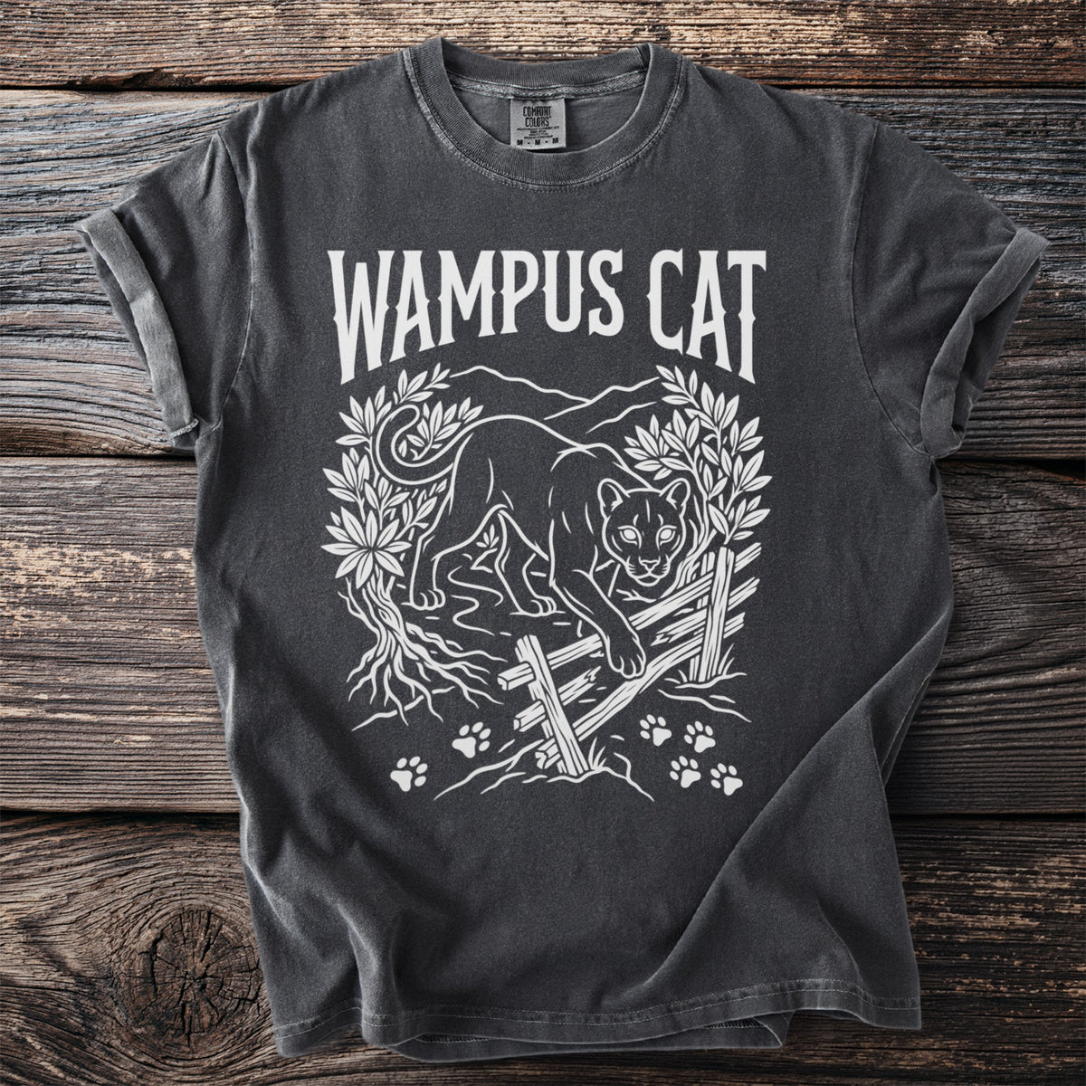 Wampus Cat graphic tee with a stylized panther and paw prints.