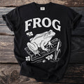 Black t-shirt with white "FROG" text and a frog on a log.