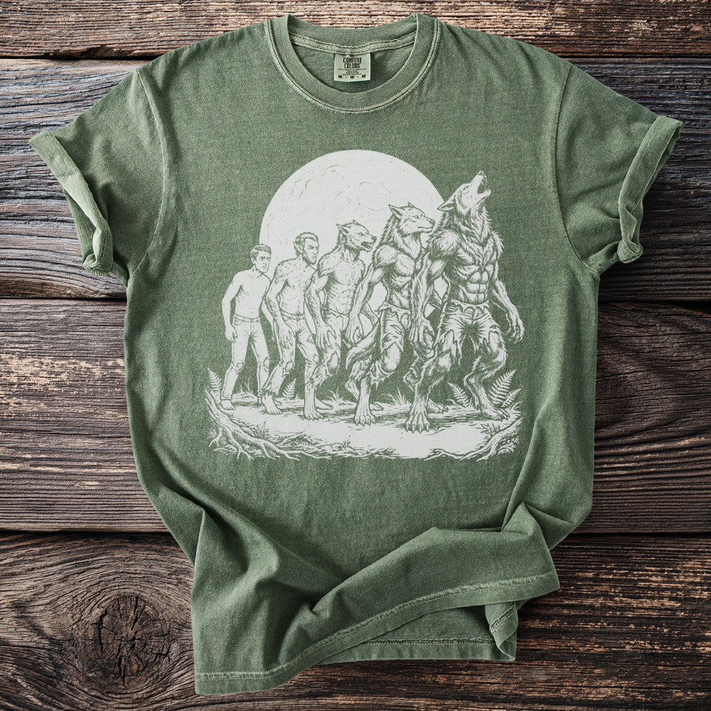 Green t-shirt with graphic of man transforming into a werewolf under a full moon.