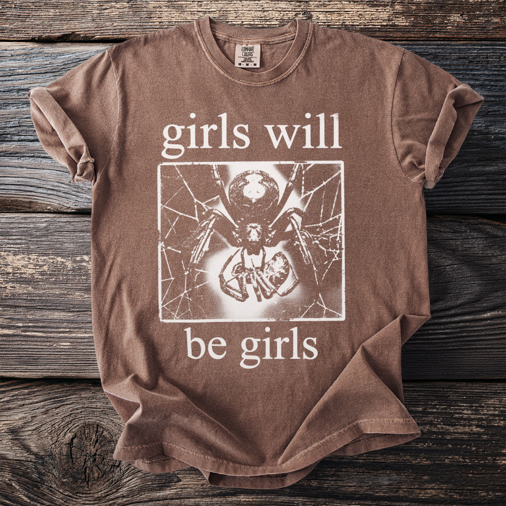 Brown t-shirt with "girls will be girls" text and spider graphic.