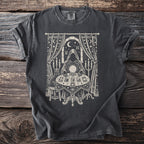 T-shirt graphic of a figure by a crystal ball, tarot cards, and a cat.