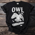 Black t-shirt with "OWL" text and a white barn owl landing on a log with a mouse.