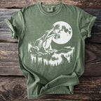 Green t-shirt with a graphic of frogs and a full moon.