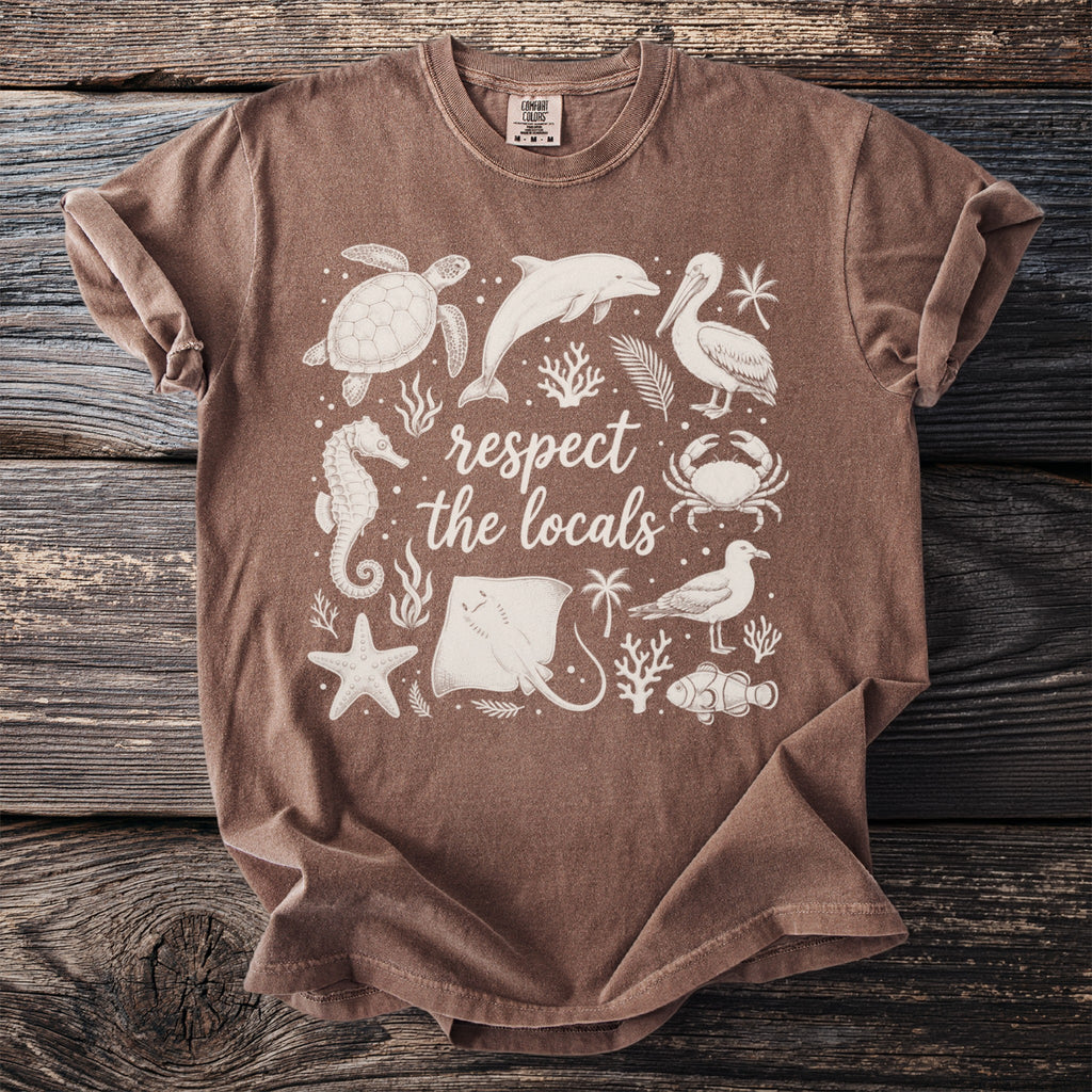 Brown t-shirt with white "respect the locals" text and various marine life graphics.