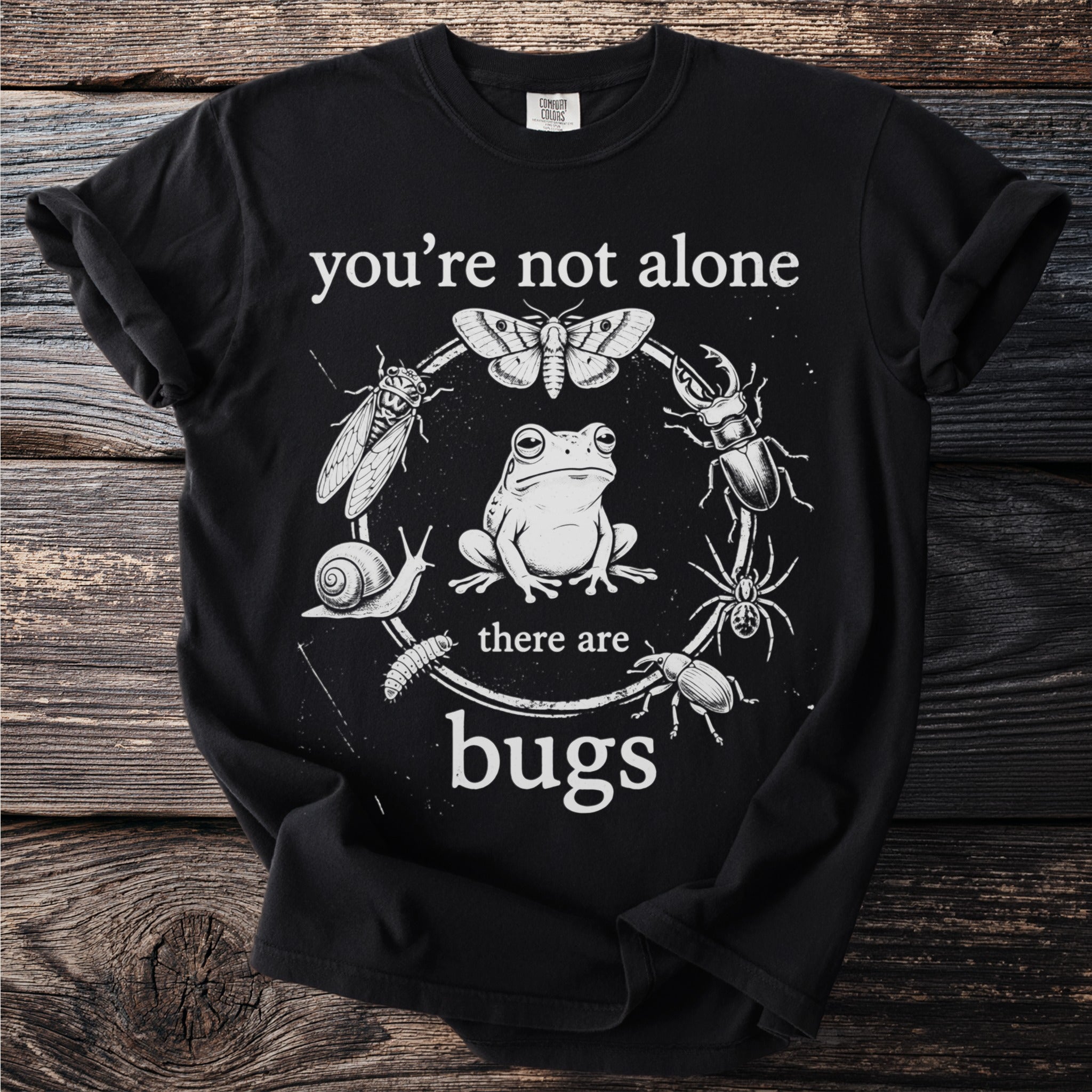 Black t-shirt with "you're not alone there are bugs" and a circular insect design.