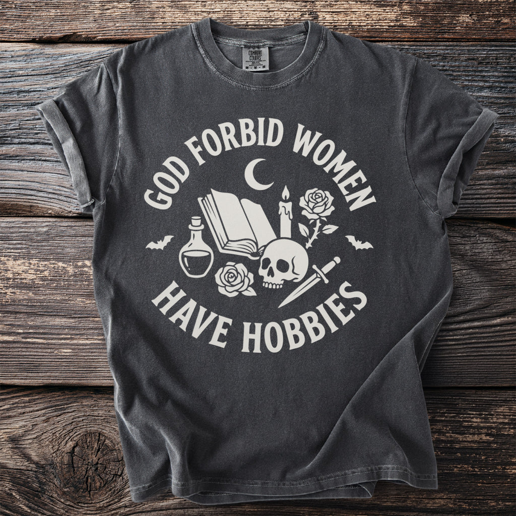 Dark grey t-shirt with "God forbid women have hobbies" and occult imagery.