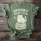 Green t-shirt with "SPOOKY BOOK CLUB" text and a cat on books.