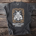 Dark t-shirt with a graphic of a horned, furry creature holding branches, saying "Naughty List Approved."