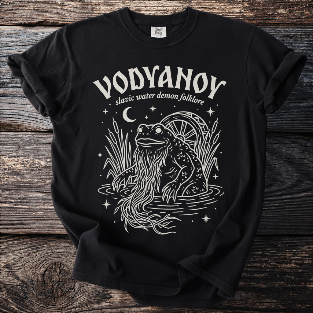 Black t-shirt with "VODYANOY slavic water demon folklore" and a frog demon design.