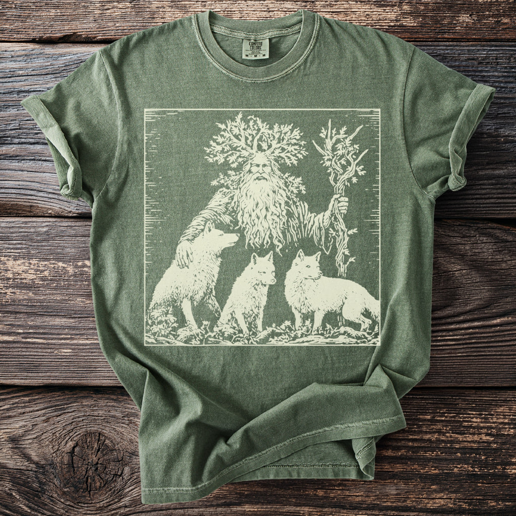 Green t-shirt with a white line art print of a man with a tree for a head, holding branches, with three wolves.