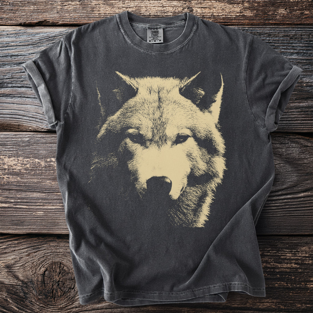 Charcoal t-shirt with a close-up etching of a wolf's face in light tan.