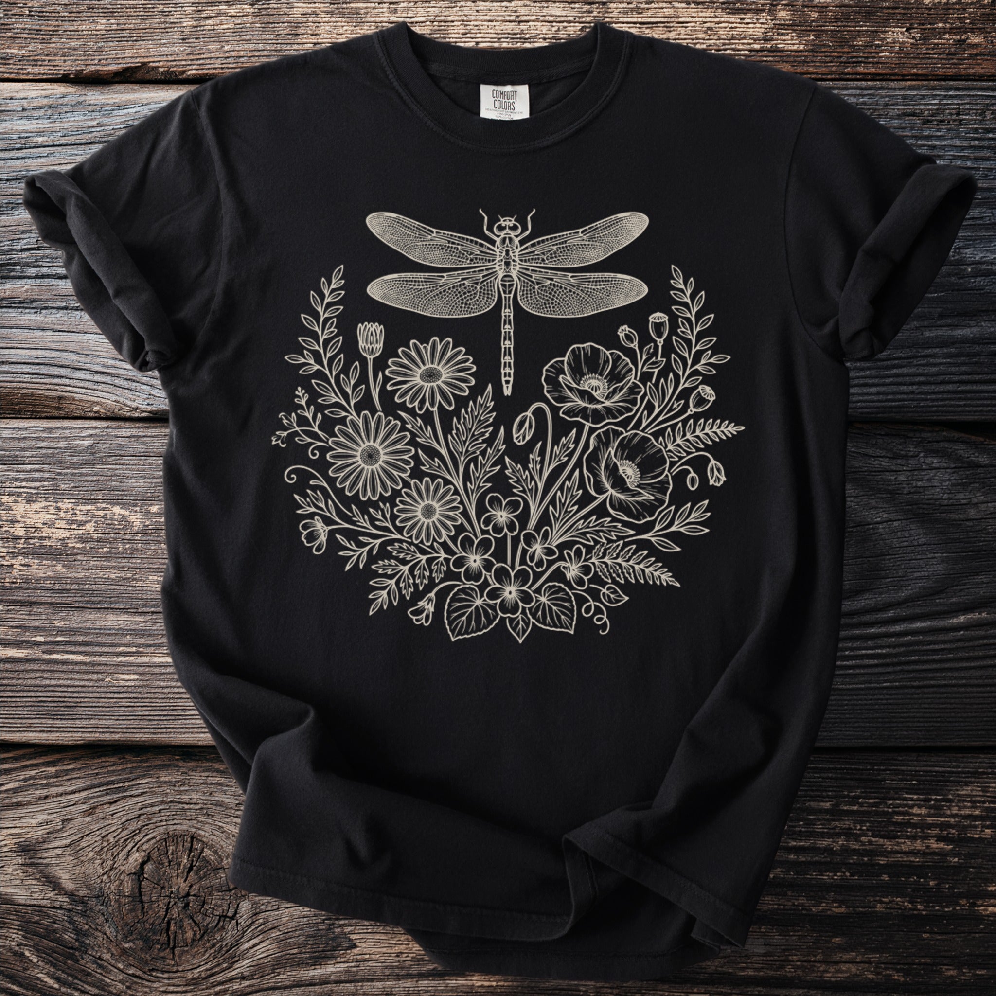 Black Comfort Colors t-shirt with a white line drawing of a dragonfly and floral border.