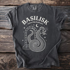 Dark grey t-shirt with white "BASILISK serpent king deadly gaze" text and snake graphic.