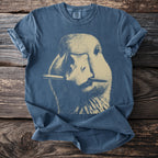 Faded blue t-shirt with a screen print of a goose holding a pen in its beak.
