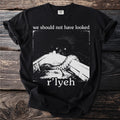 Black t-shirt with "we should not have looked r'lyeh" text and dark, abstract art.