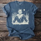 T-shirt with a cream-colored scarecrow design in a cornfield at night.