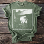 Green t-shirt with rabbit graphic and text "i was not made to be perceived".