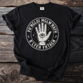 Black t-shirt with a circular emblem featuring a hand with an eye, stars, and text.
