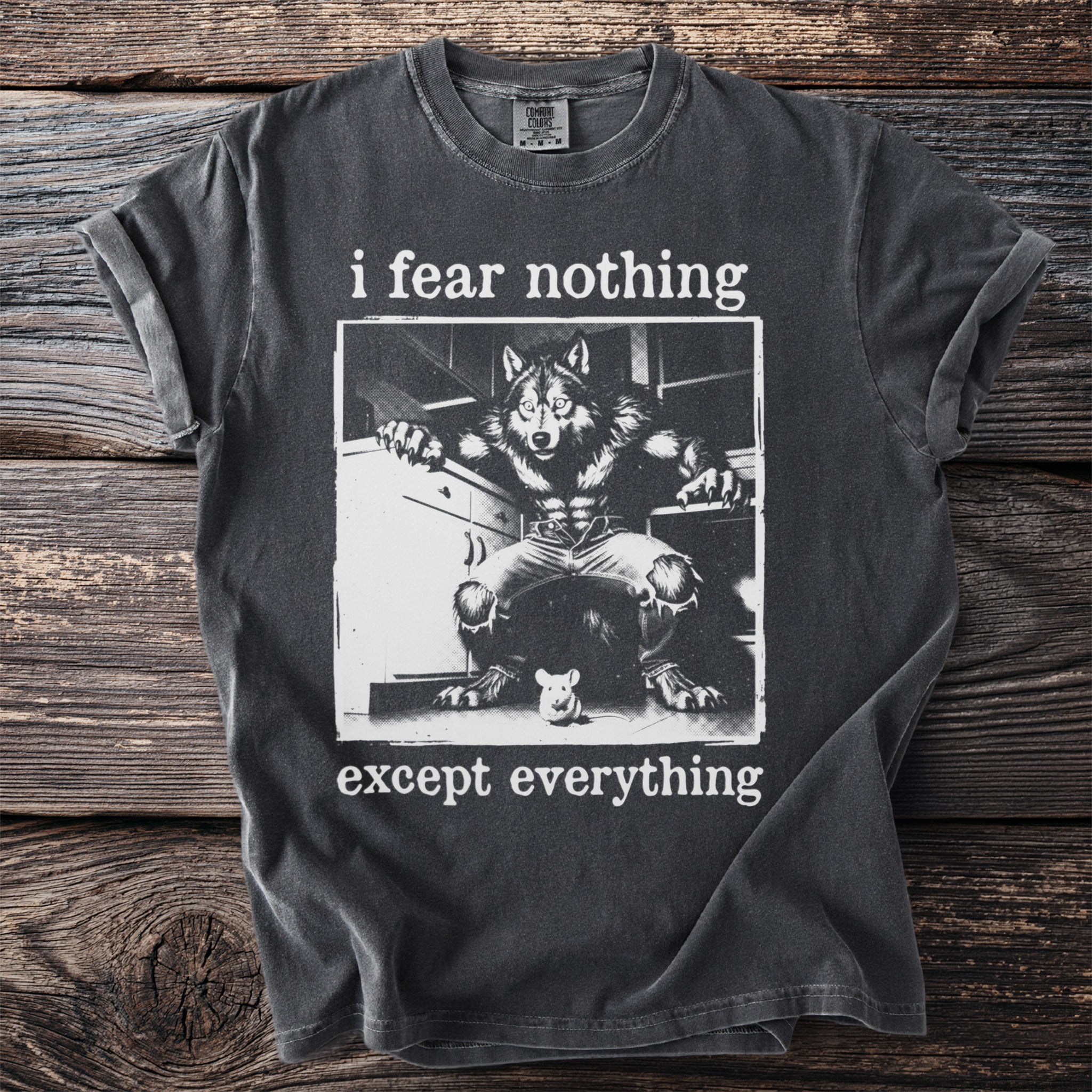 Dark grey t-shirt with werewolf and mouse graphic and text "i fear nothing except everything".