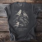 The Corvid Cabinet t-shirt features illustrations of various corvids with their names.