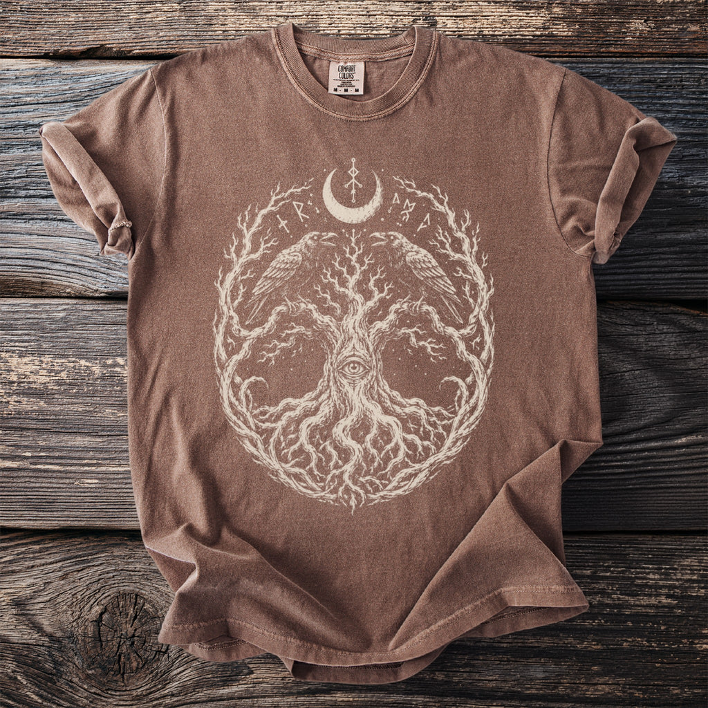 Brown t-shirt with a white tree of life design featuring ravens and an eye.