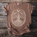 Brown t-shirt with a white tree of life design featuring ravens and an eye.