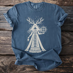Blue t-shirt with cream print of a horned goddess holding a sun symbol.