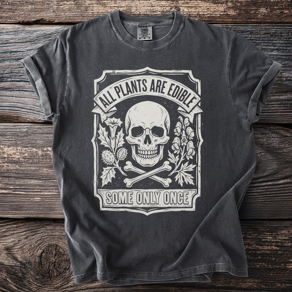 T-shirt with skull, bones, plants, and text "All Plants Are Edible Some Only Once".