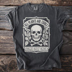 T-shirt with skull, bones, plants, and text "All Plants Are Edible Some Only Once".