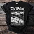Black t-shirt with wolves in mountains graphic and text: The Wolves Yellowstone Comeback Tour.