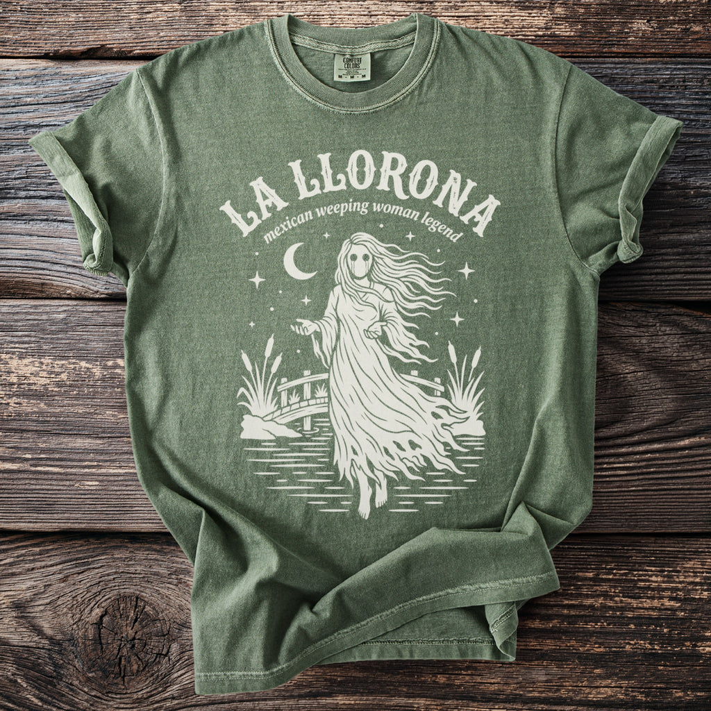 Green t-shirt with "La Llorona Mexican weeping woman legend" text and graphic.