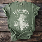 Green t-shirt with "La Llorona Mexican weeping woman legend" text and graphic.