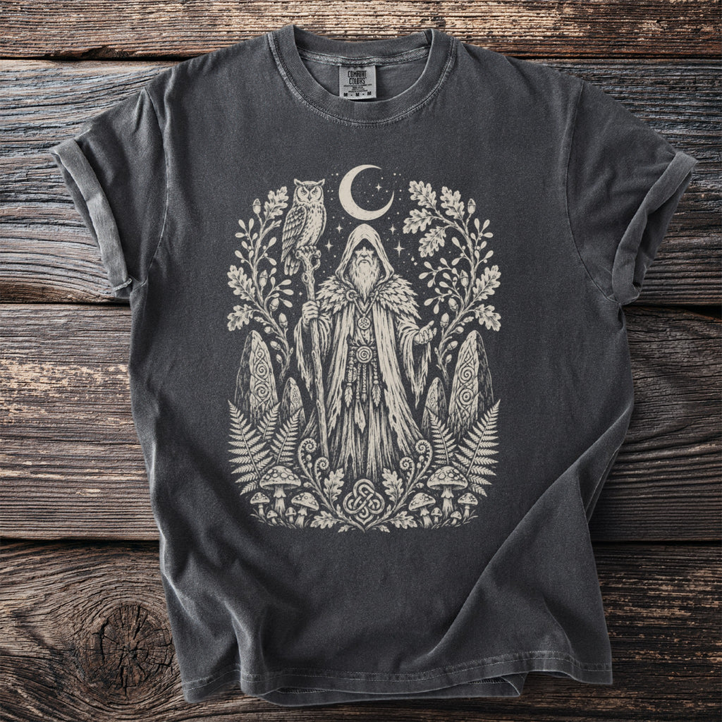 Dark grey t-shirt with a cream-colored graphic of a wizard, owl, moon, and forest elements.
