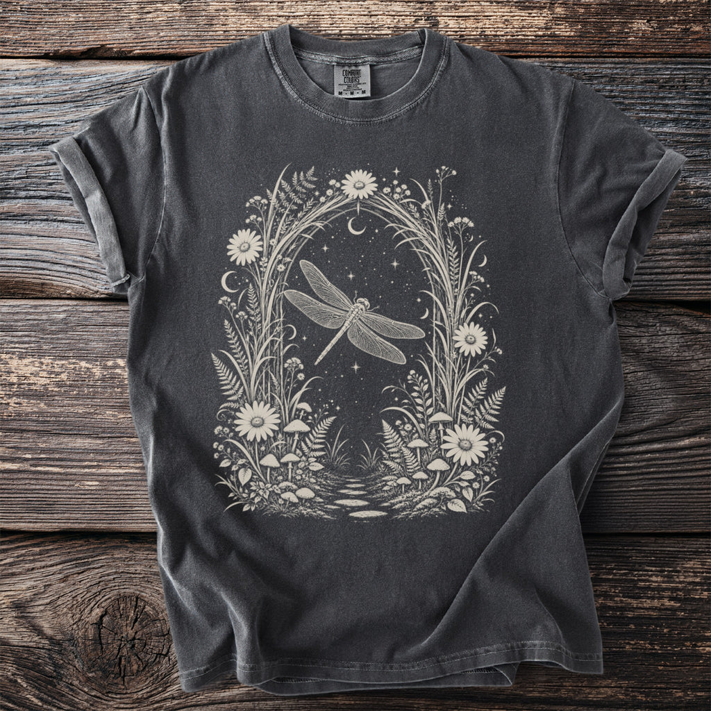Dark grey t-shirt with creamy white linework art of a dragonfly in a floral archway.
