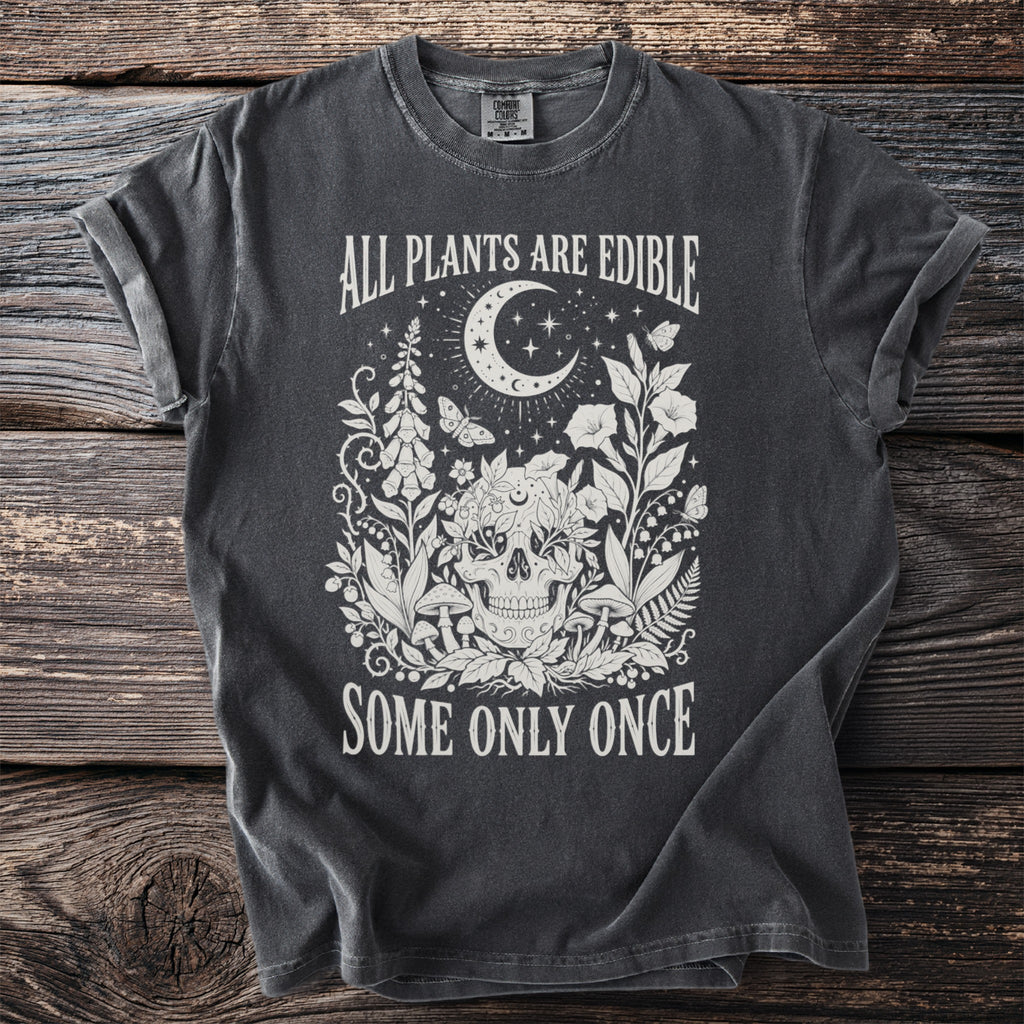 Dark grey t-shirt with skull and gothic botanical illustration and text.
