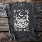 Dark grey t-shirt with skull and gothic botanical illustration and text.