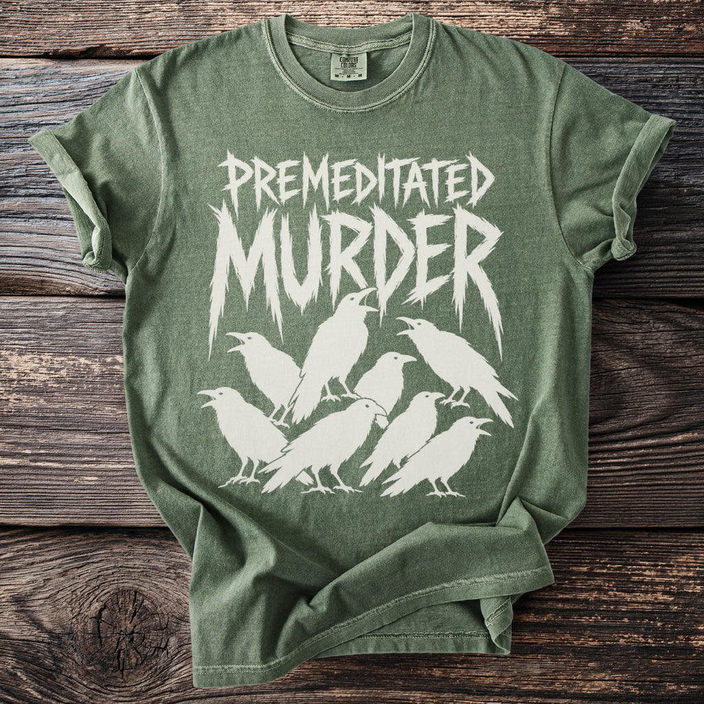 Green t-shirt with white "PREMEDITATED MURDER" text and a flock of crows.