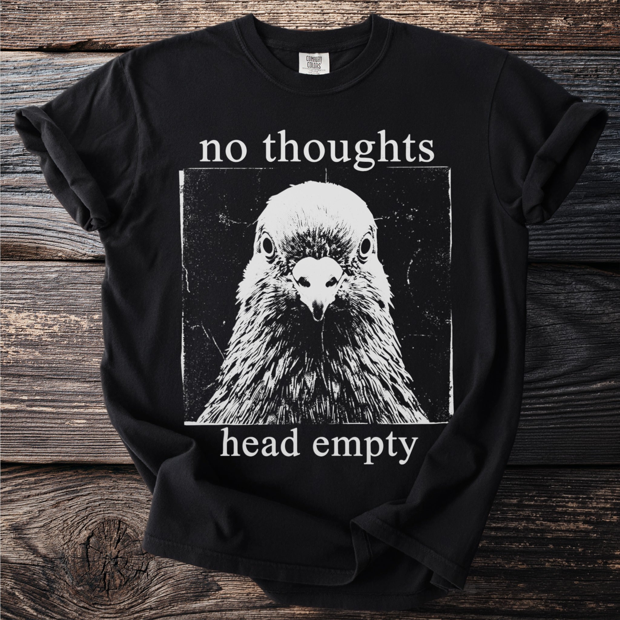 Black t-shirt with "no thoughts head empty" text and a pigeon graphic.