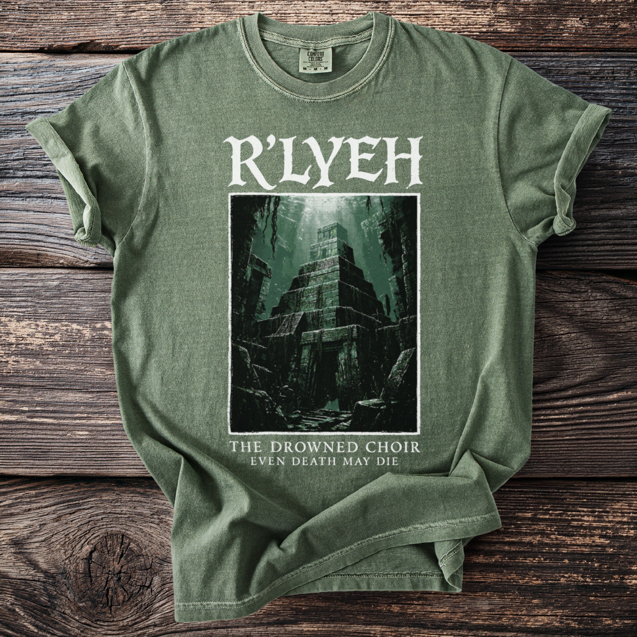 Green t-shirt with R'LYEH, sunken pyramid, and text "THE DROWNED CHOIR EVEN DEATH MAY DIE".